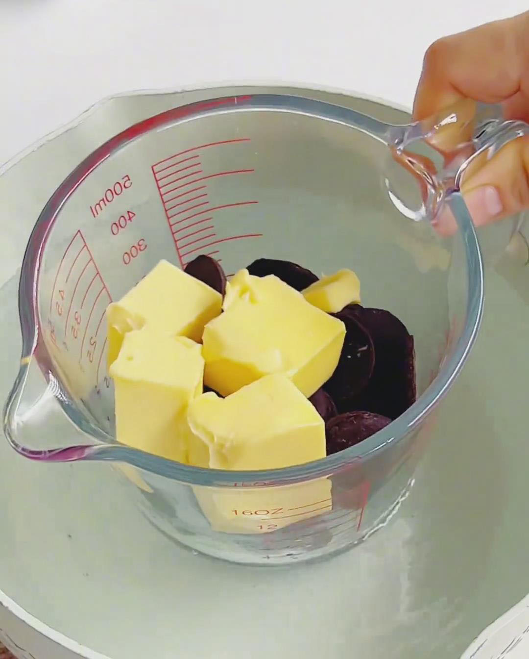 Melt 120g chocolate and 70g butter over a double boiler