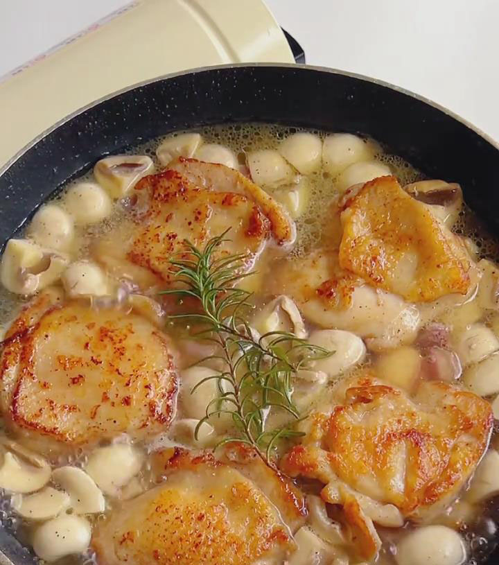 Simmer chicken in sauce