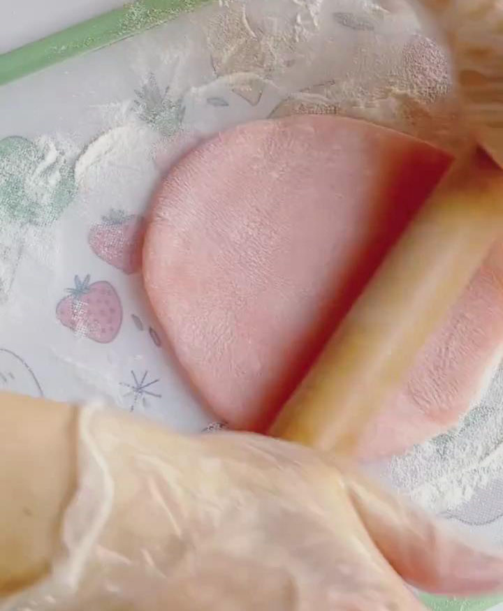 Take one dough ball and flatten it with a rolling pin