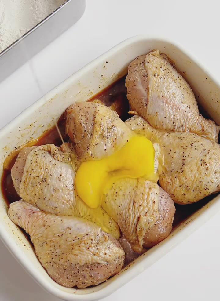 crack one egg into the bowl with the drumsticks