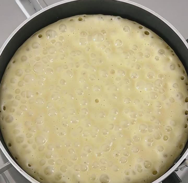 Cook until bubbles appear on the surface