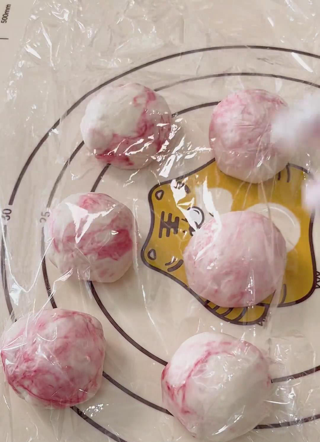 Cover the balls with plastic wrap