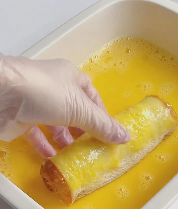 Dip each toast roll into the beaten eggs