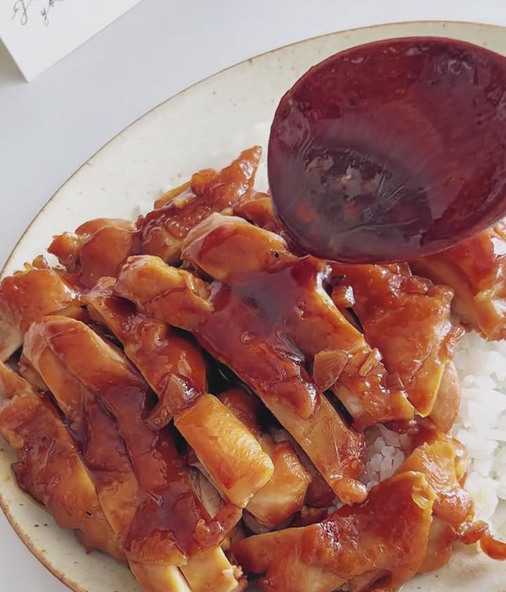 Drizzle any remaining glaze from the pan over the chicken and rice