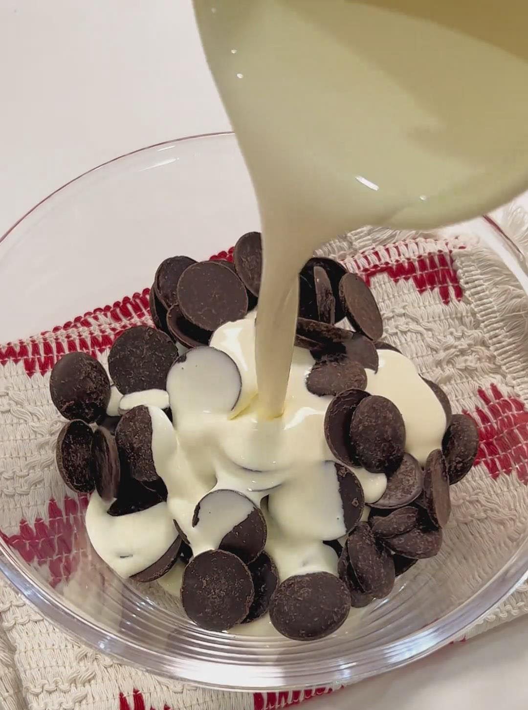 Add the dark chocolate pieces and heavy cream to a small pot or heatproof bowl