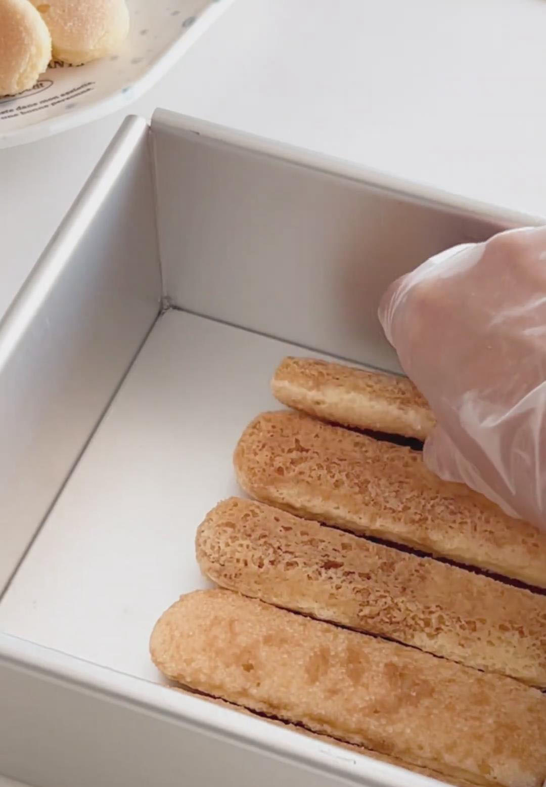 Arrange a single, snug layer of dipped ladyfingers in the bottom of a 6 inch mold