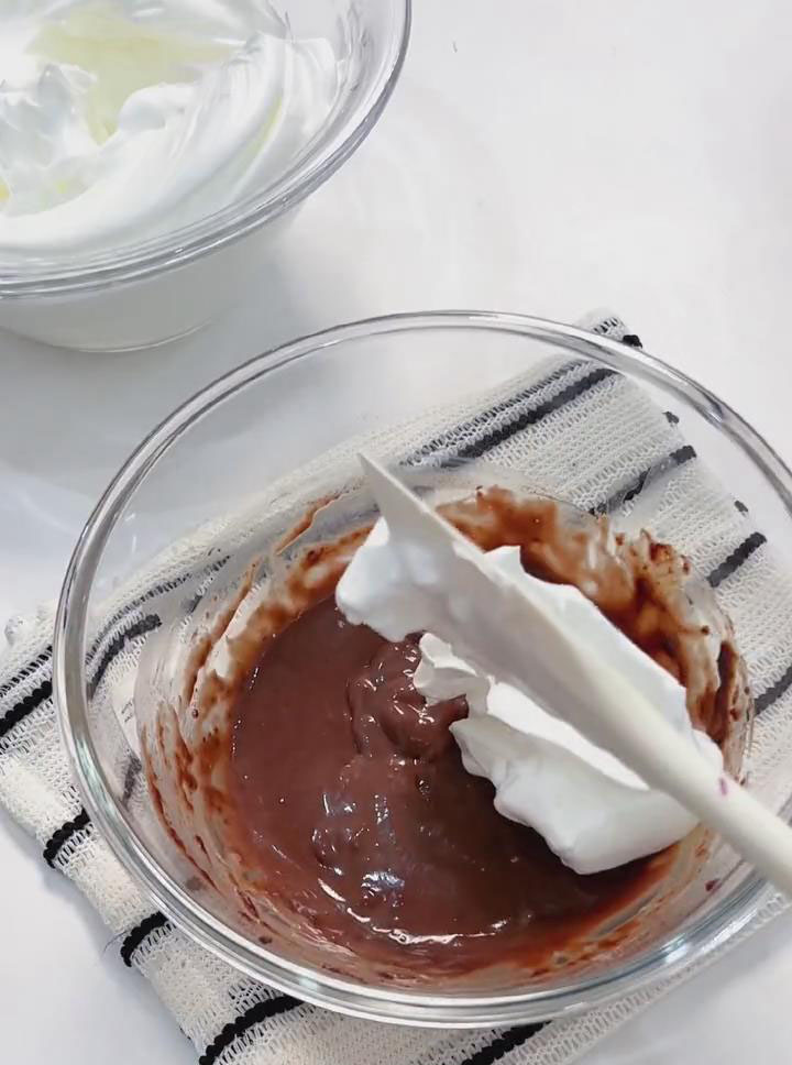 Fold one third of the meringue into the yolk batter