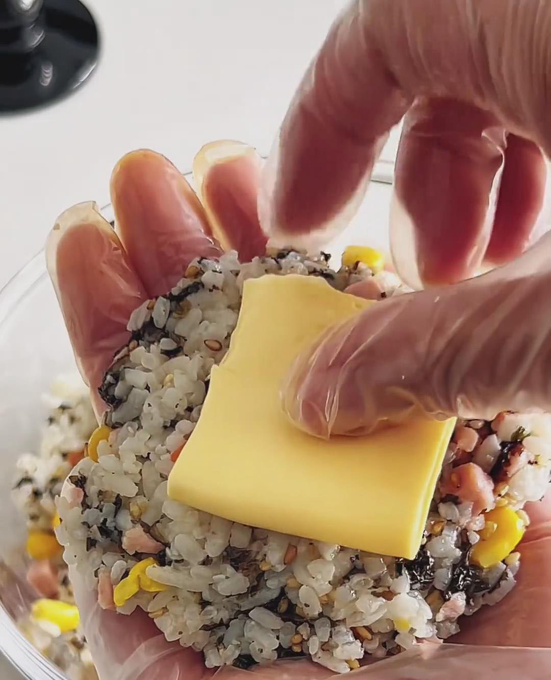 Place one slice of cheese in the center (you can fold it to fit)