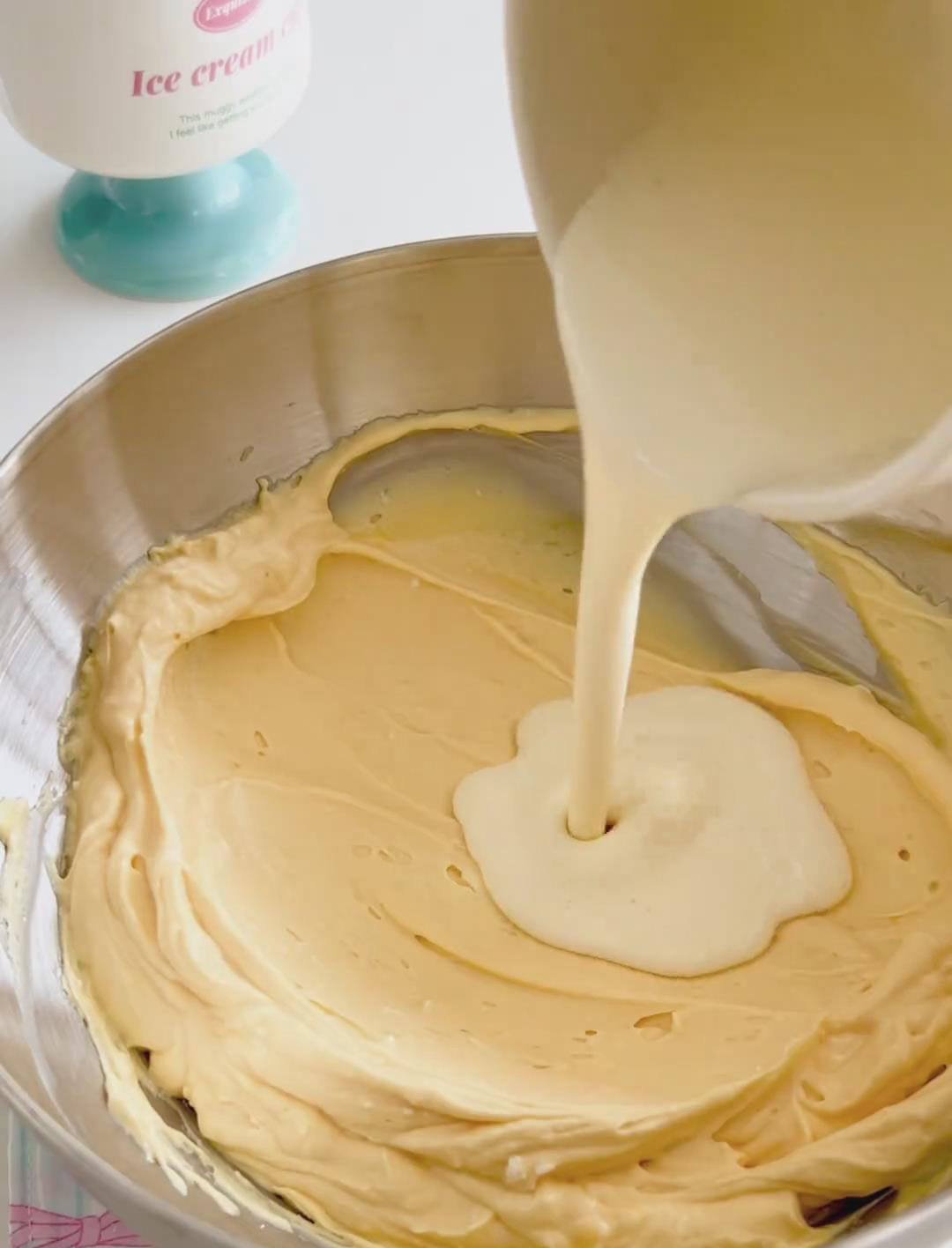 Pour the slightly warm gelatin cream mixture into the mascarpone egg mixture