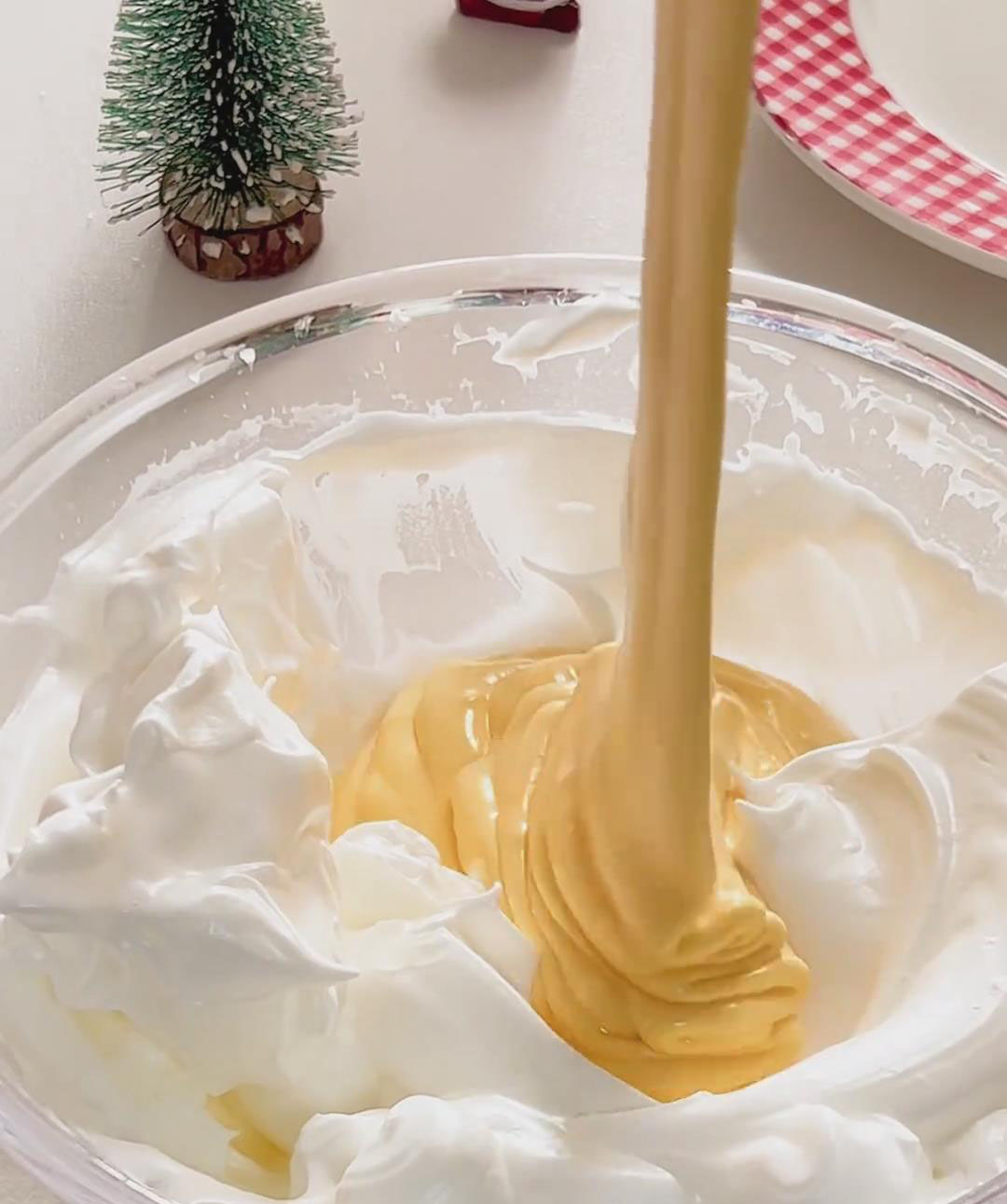 Pour this mixture back into the remaining meringue