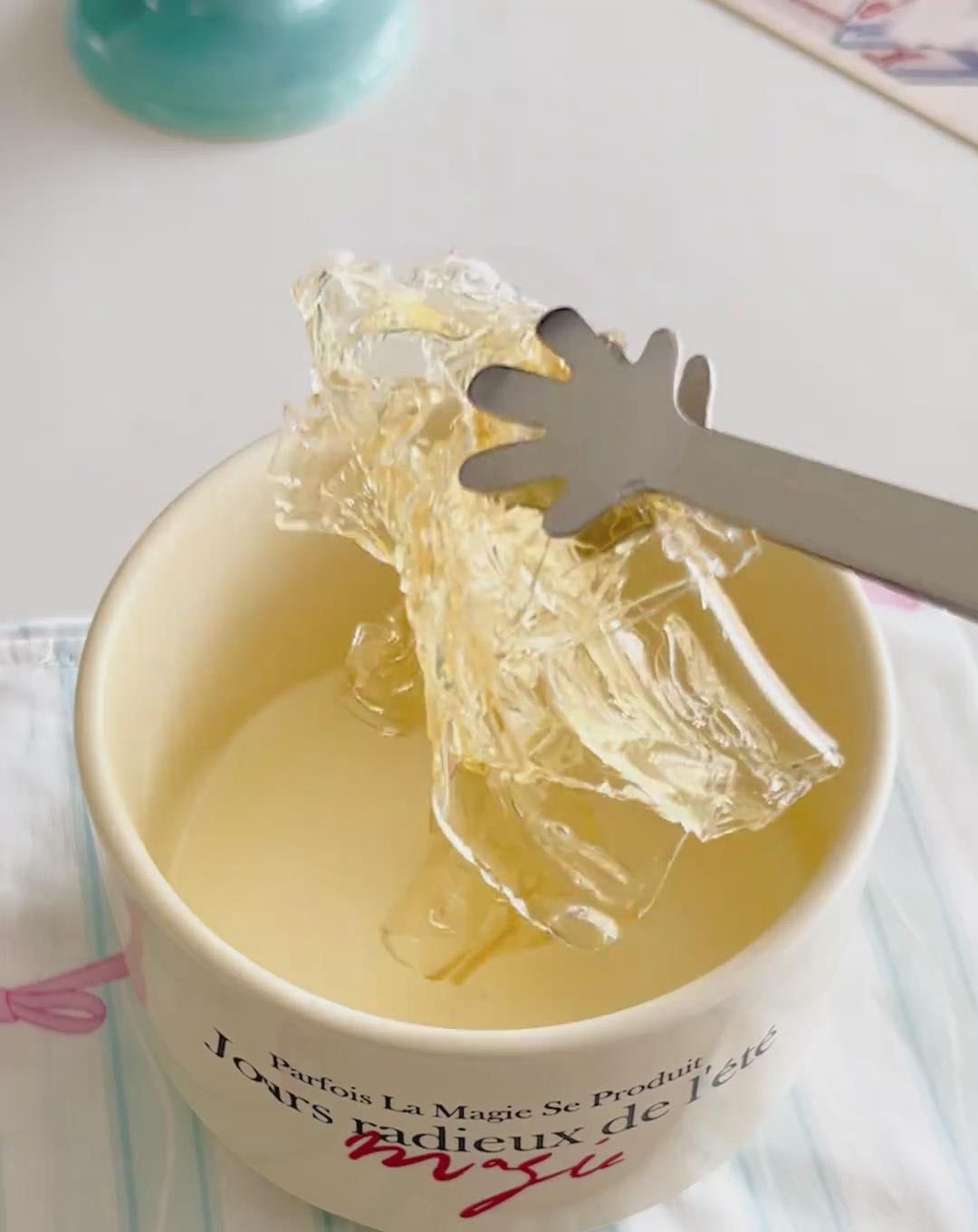 Squeeze all excess water from the softened gelatin sheets
