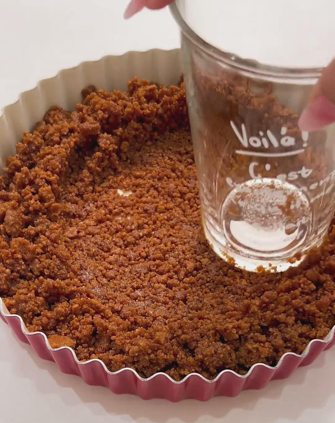 Transfer the mixture into an 8 inch tart pan and press firmly using the bottom of a glass