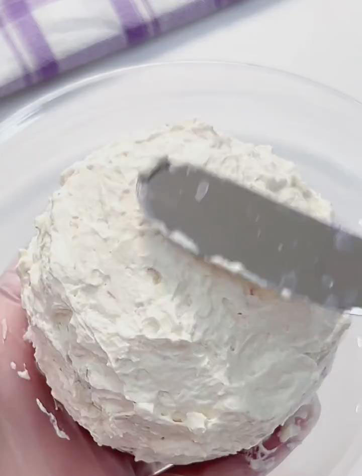 Use a spatula to spread a thin, even layer of strawberry cream