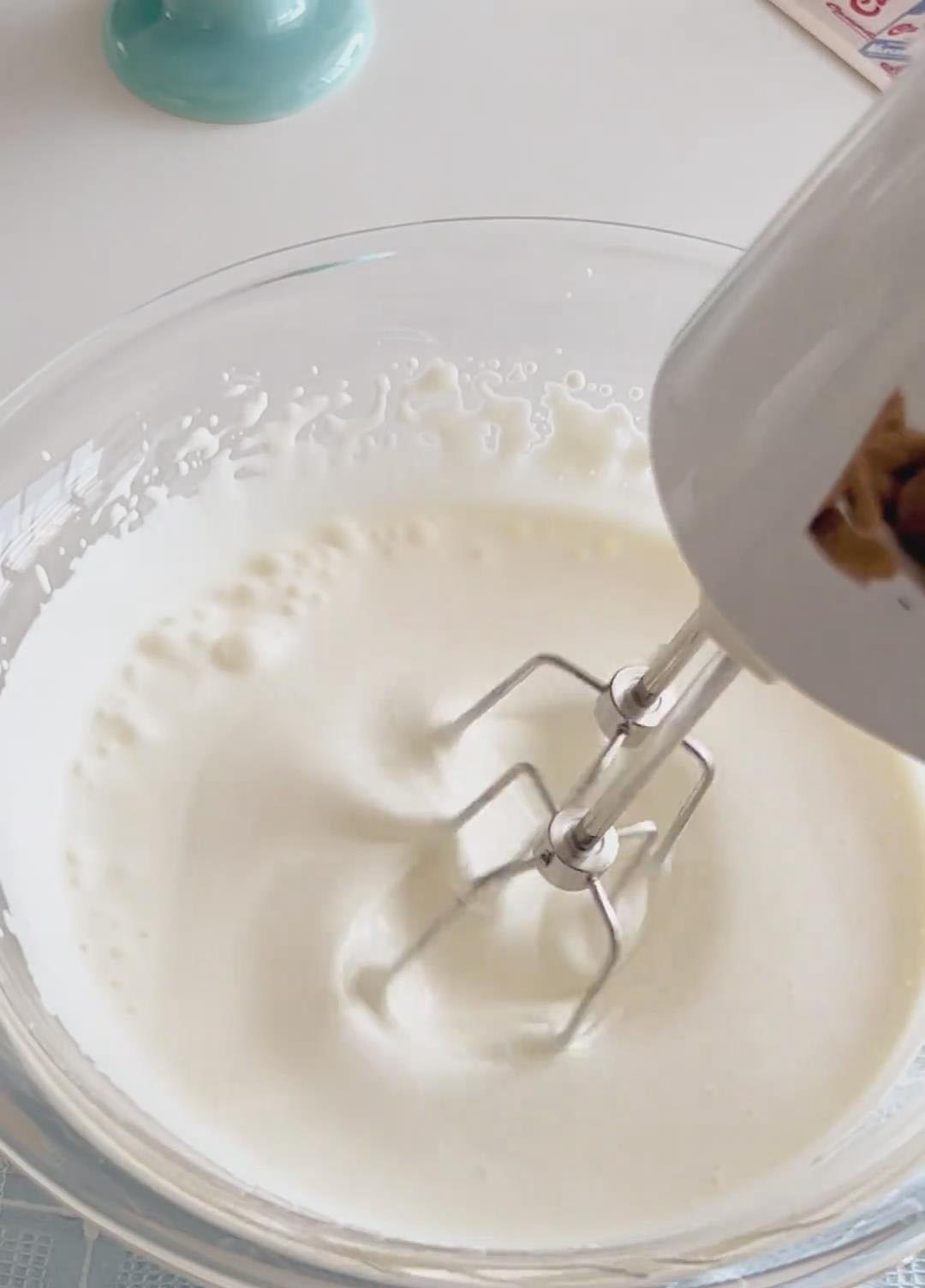 Whip with an electric mixer on medium speed until it reaches medium peaks