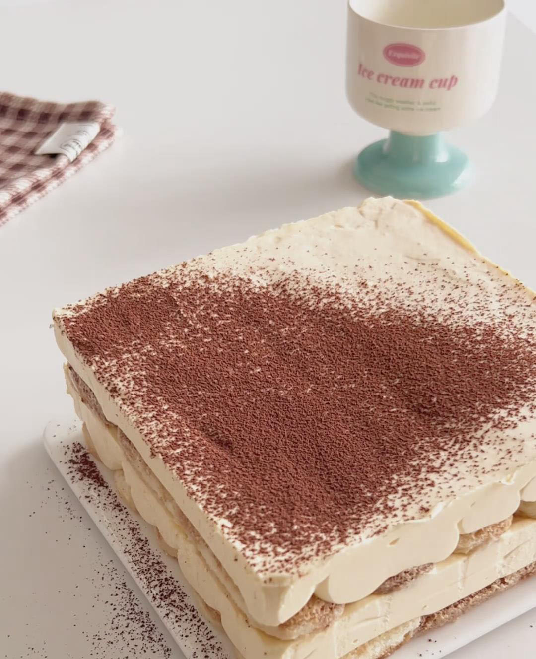 dust the entire top with a thick, even layer of unsweetened cocoa powder