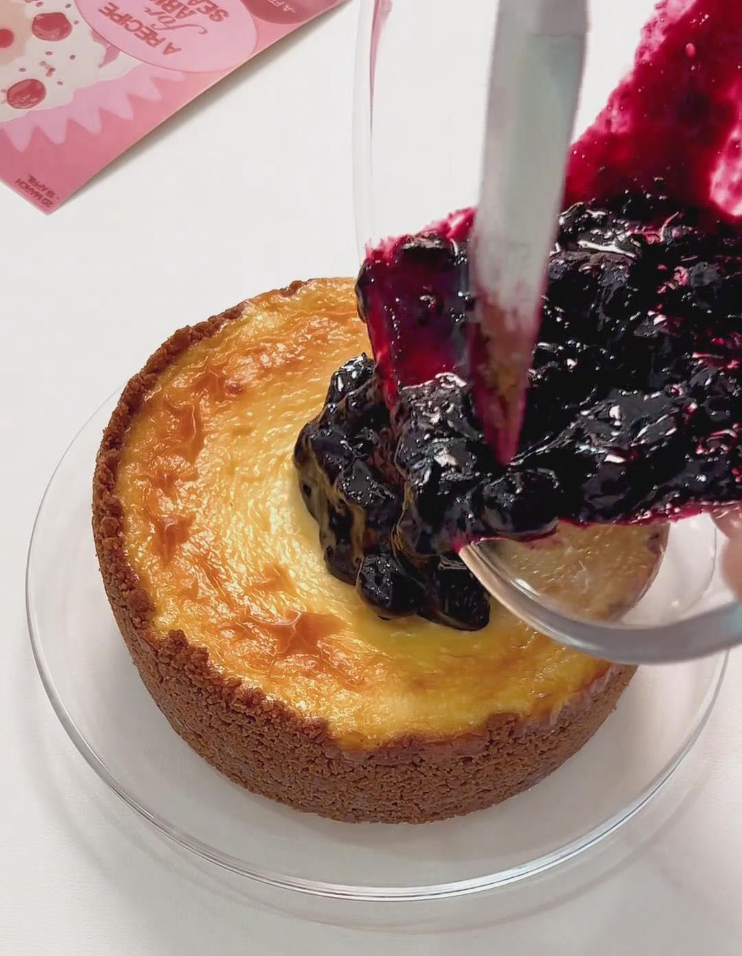 pour the cooled blueberry sauce over the center of the cheesecake