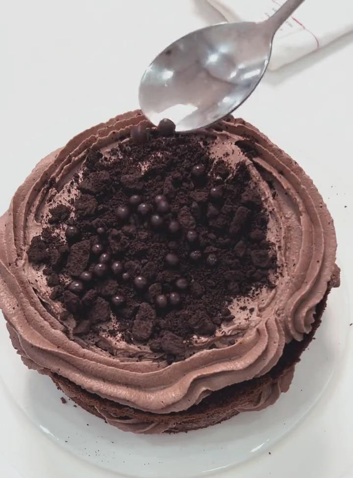 sprinkle with Oreo crumbs and chocolate pearls