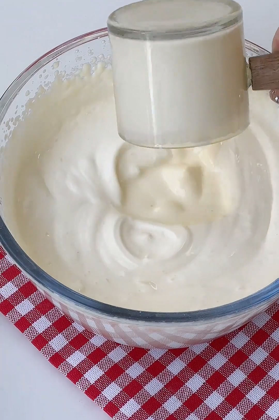 Add the yogurt to the whipped cream