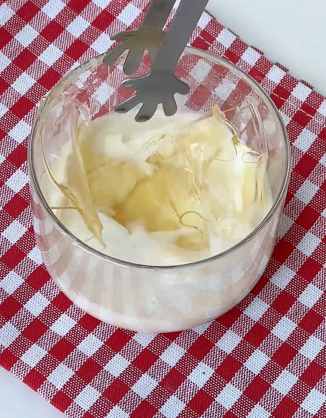 Place them in a small bowl with the hot milk and stir until the gelatin is completely dissolved and the liquid is clear