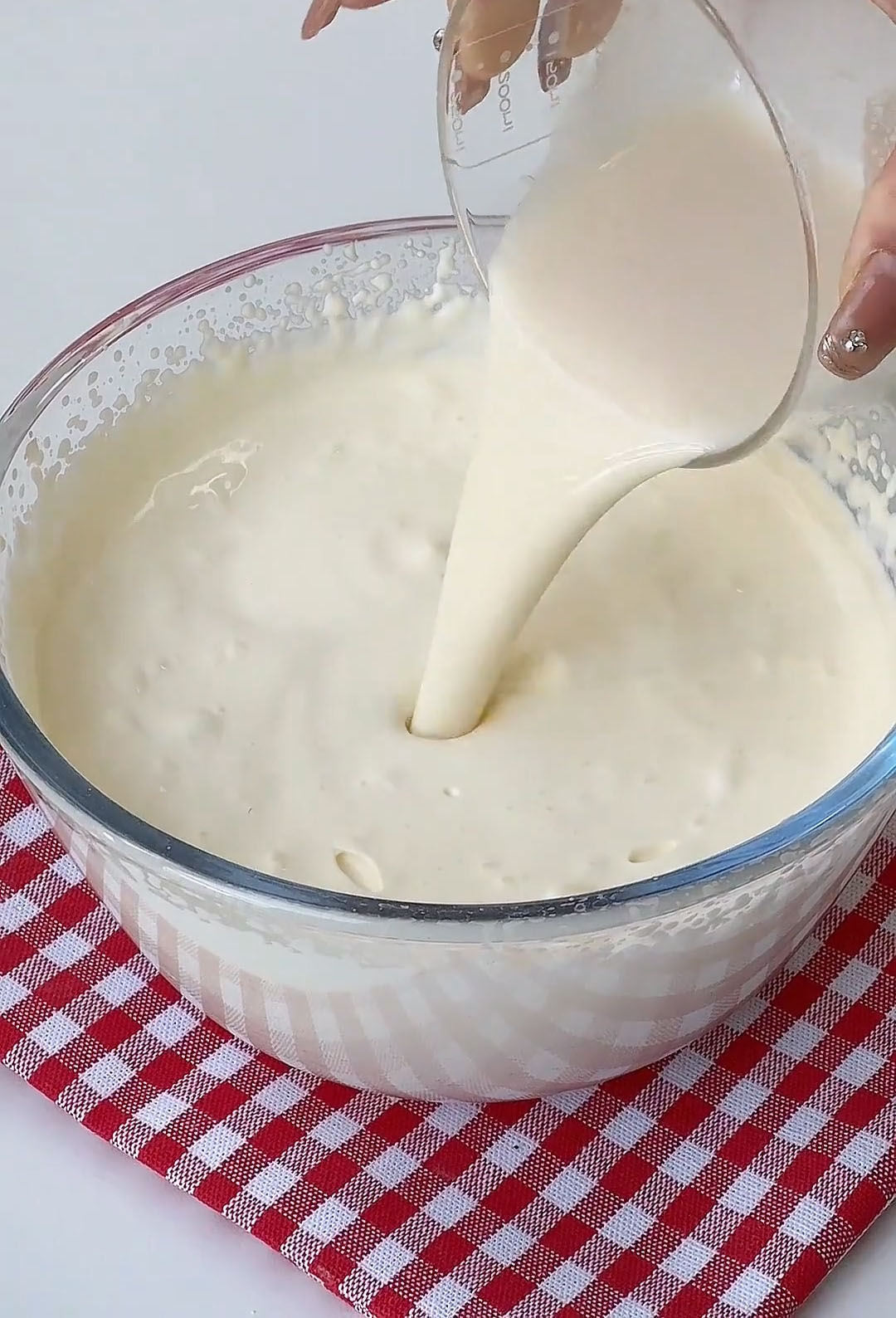 slowly drizzle the cooled gelatin milk mixture into the yogurt cream mixture