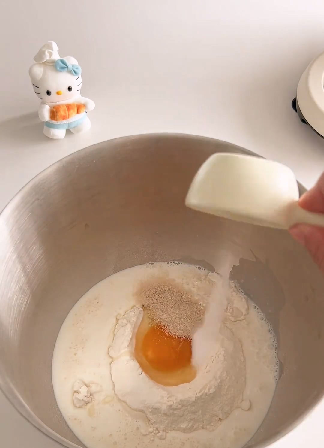 Add bread flour, sugar, whole egg, milk, high sugar yeast, and salt into a mixing bowl.