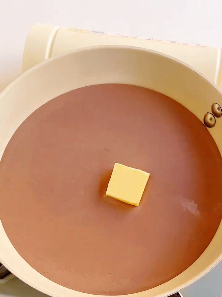 Add the softened butter to the pan with the batter