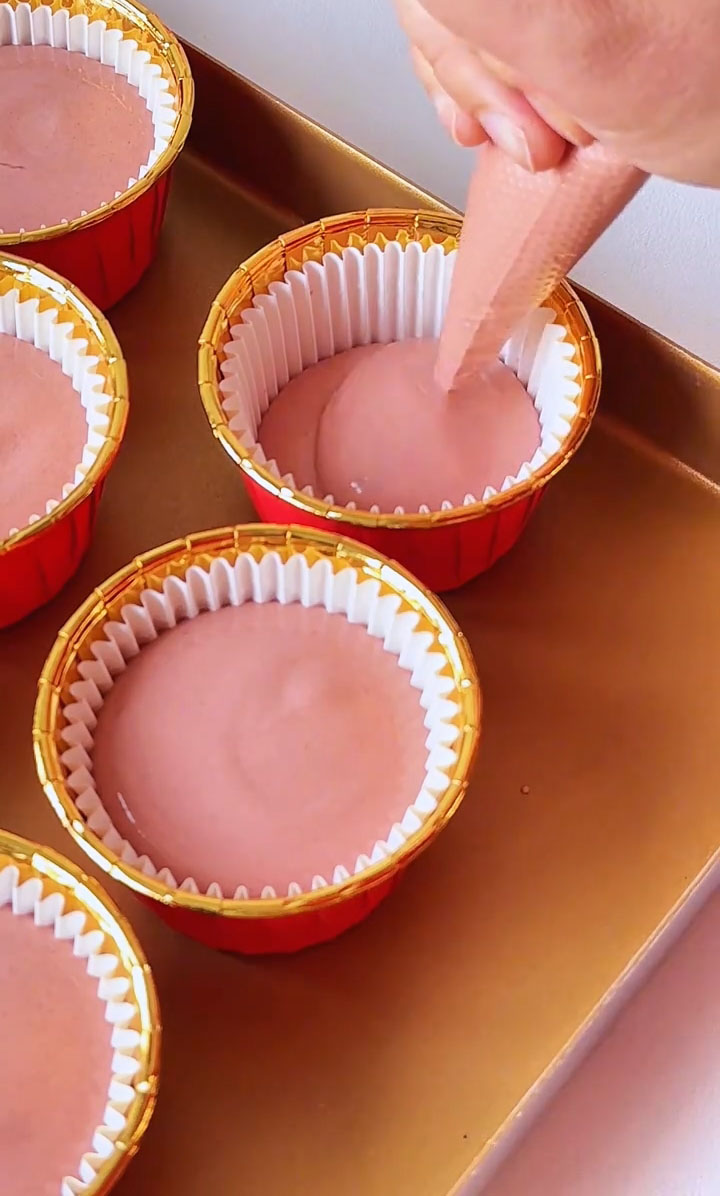 Divide the batter evenly among the prepared cupcake liners