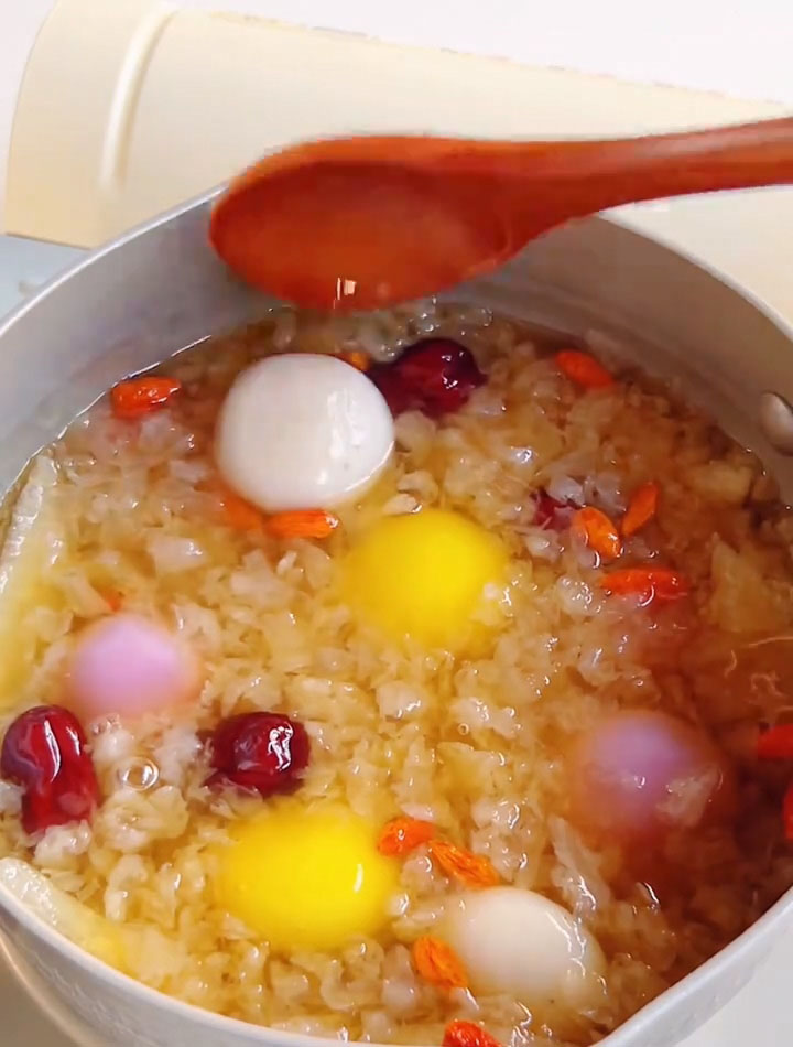 Drain the glutinous rice balls from the cold water and add them to the soup