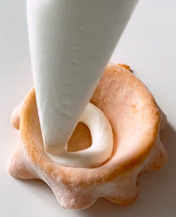 Pipe a layer of the cold whipped cream into the center