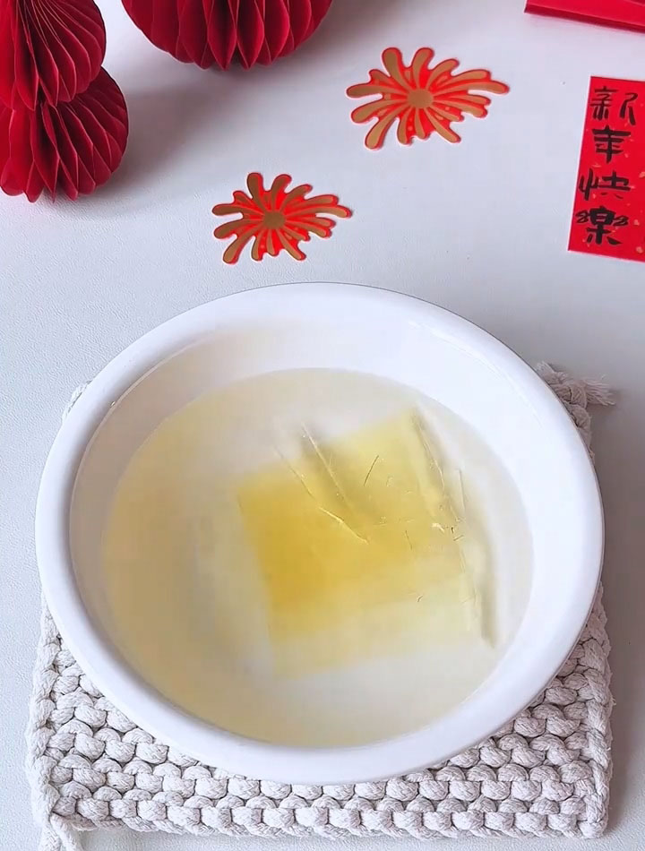 Place the gelatin sheets in a shallow dish and cover completely with cold water