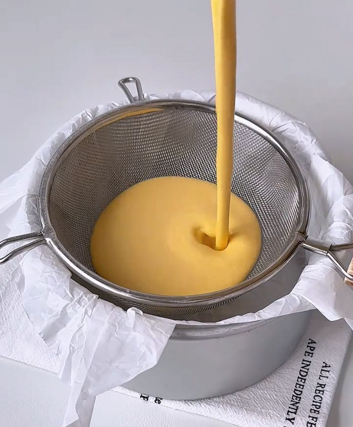 Pour about one third of the batter through a sieve into the prepared pan