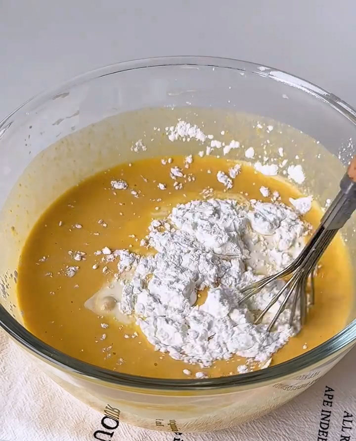 Pour in the whipping cream and sift in the cornstarch