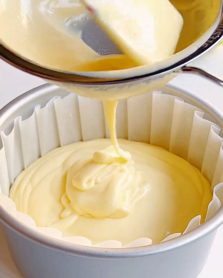 Pour the batter through a fine mesh sieve into the prepared pan