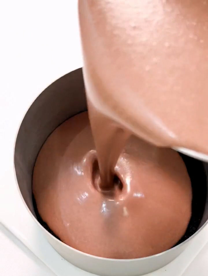 Pour the chocolate mousse over the base