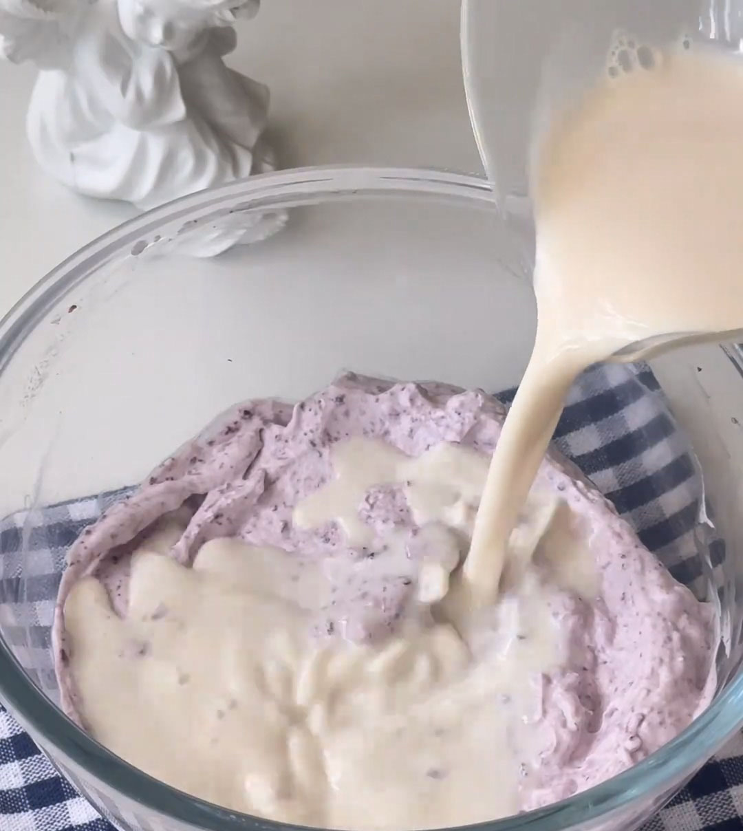 Pour the warm (not hot) gelatin milk mixture into the blueberry cream