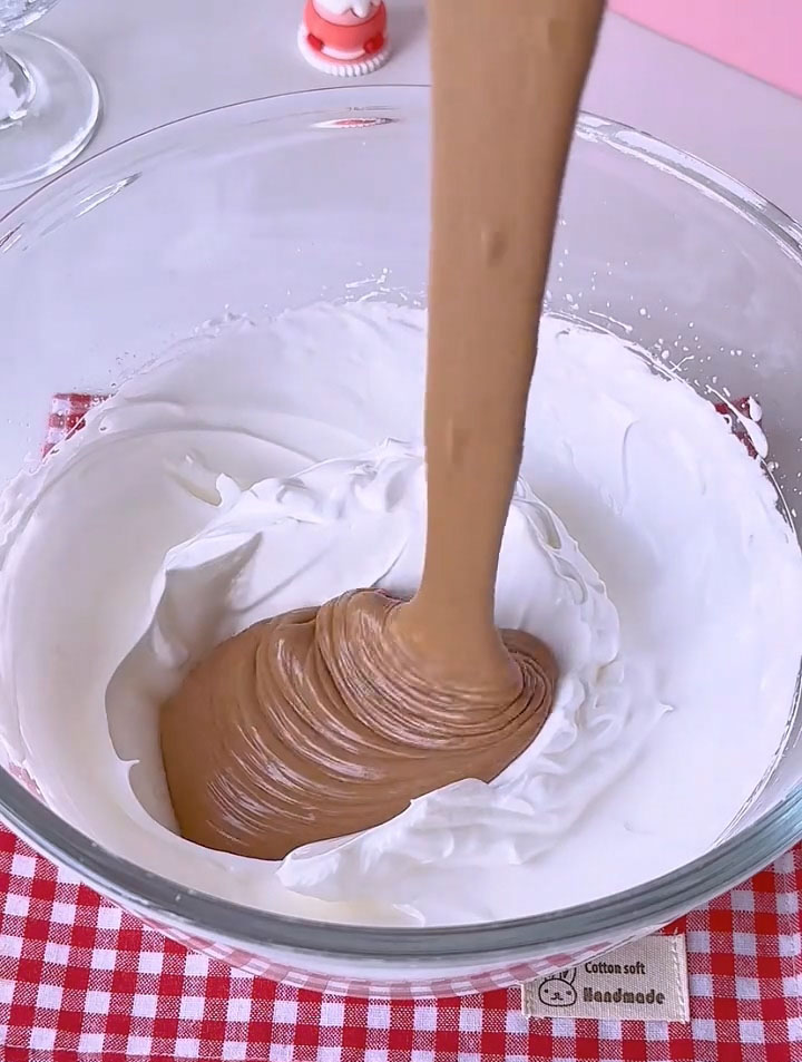 Pour this mixture back into the bowl with the remaining meringue