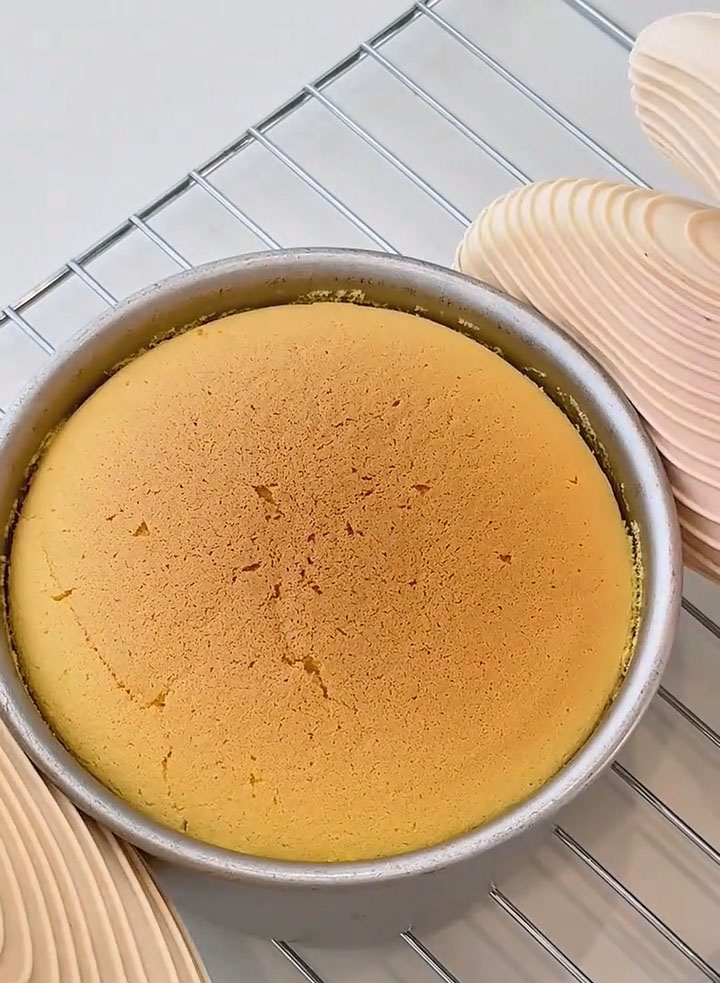 Remove the cake from the oven immediately and gently tap the pan to release internal heat