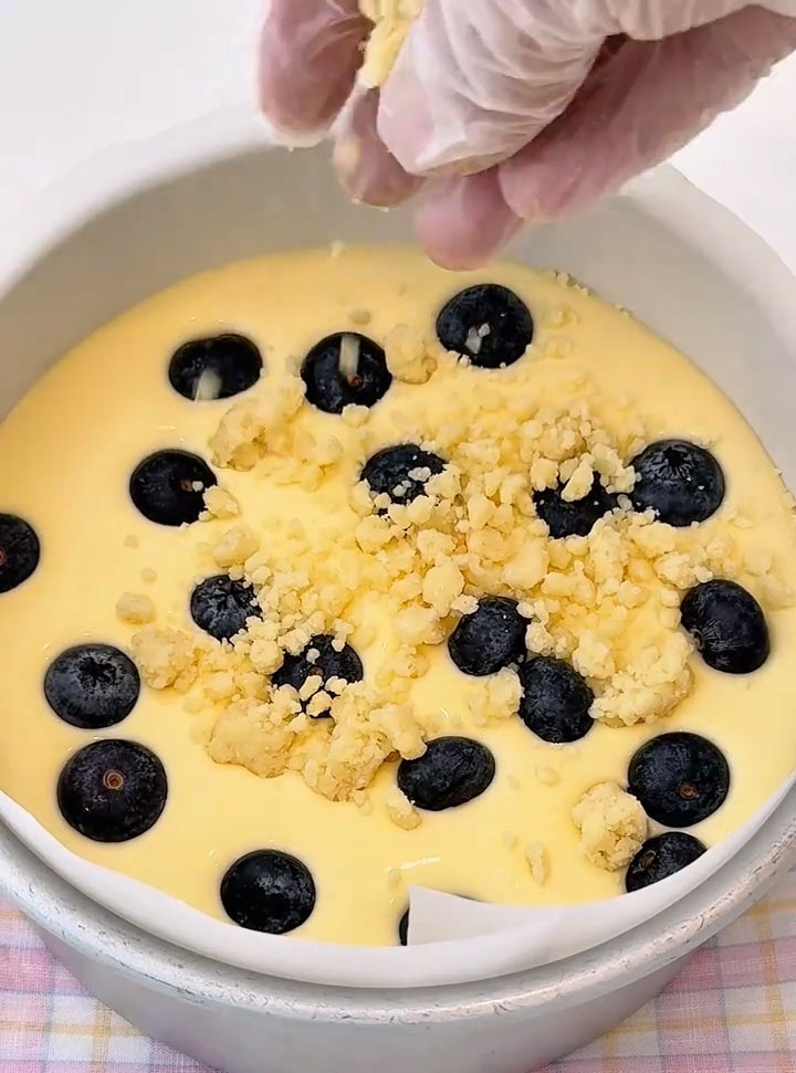 Scatter about half of your fresh blueberries evenly over the surface of the batter