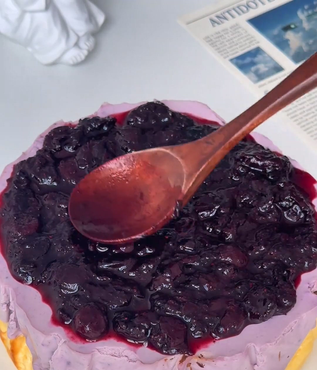 Spread a thin, even layer of blueberry jam over the top of the mousse