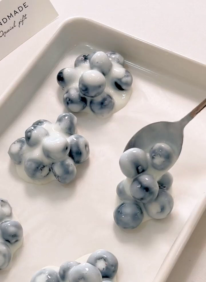 Use a spoon or small cookie scoop to portion the yogurt coated blueberries into small clusters