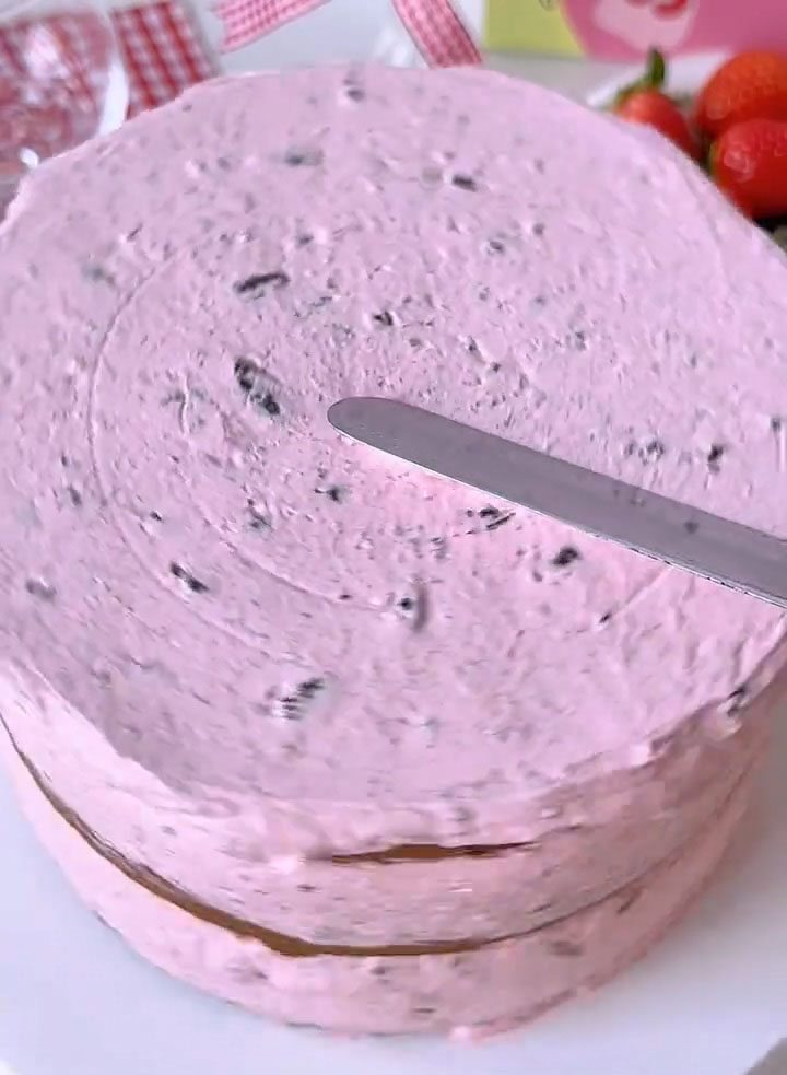 Use the remaining cream to frost the top and sides of the cake