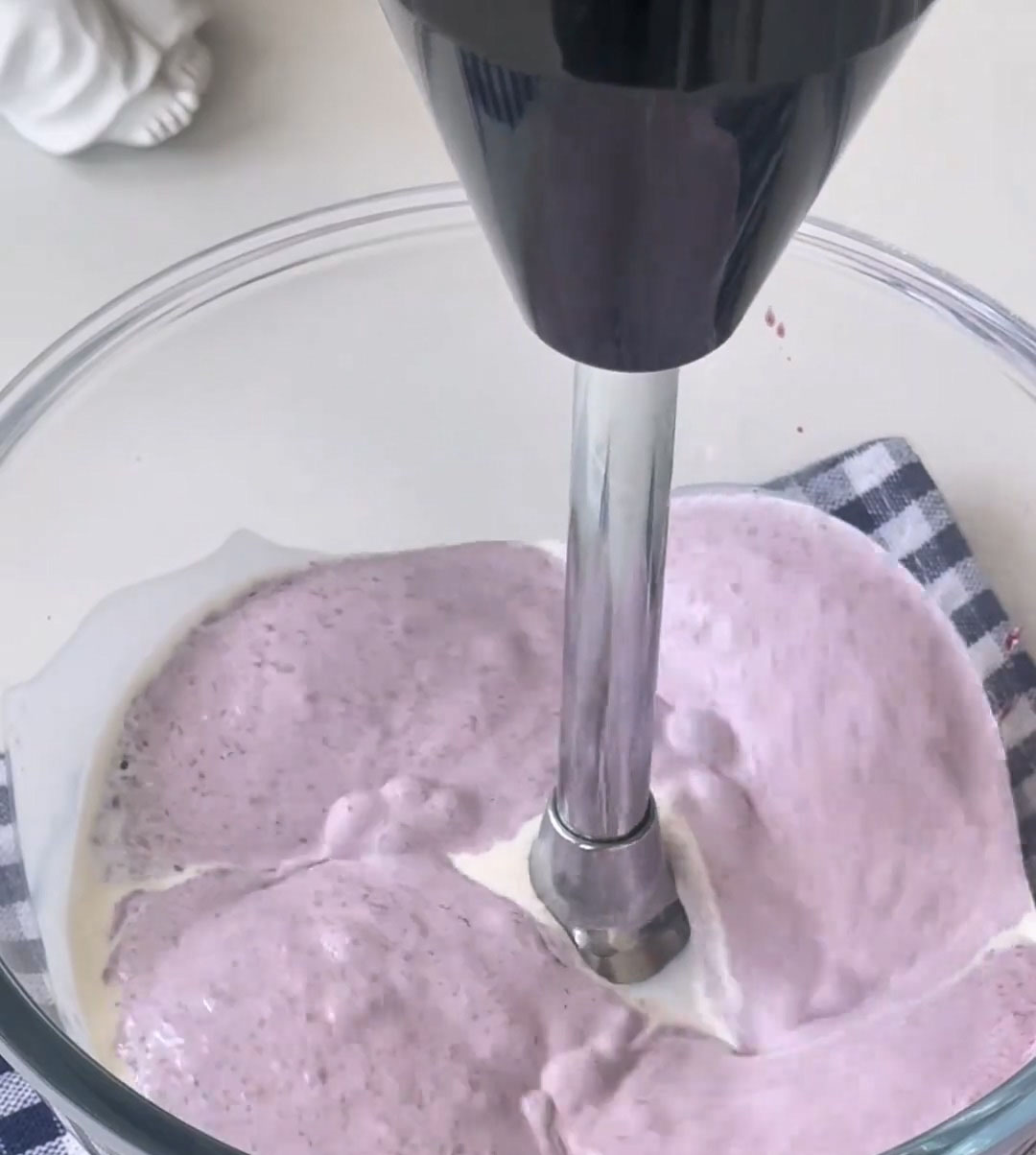 Whip the mixture using a hand mixer or whisk until it thickens to the consistency of thick Greek yogurt