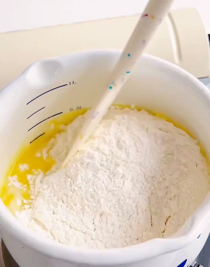 add all of the sifted cake flour at once