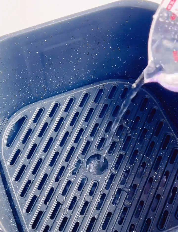 add some water to the bottom of the air fryer drawer