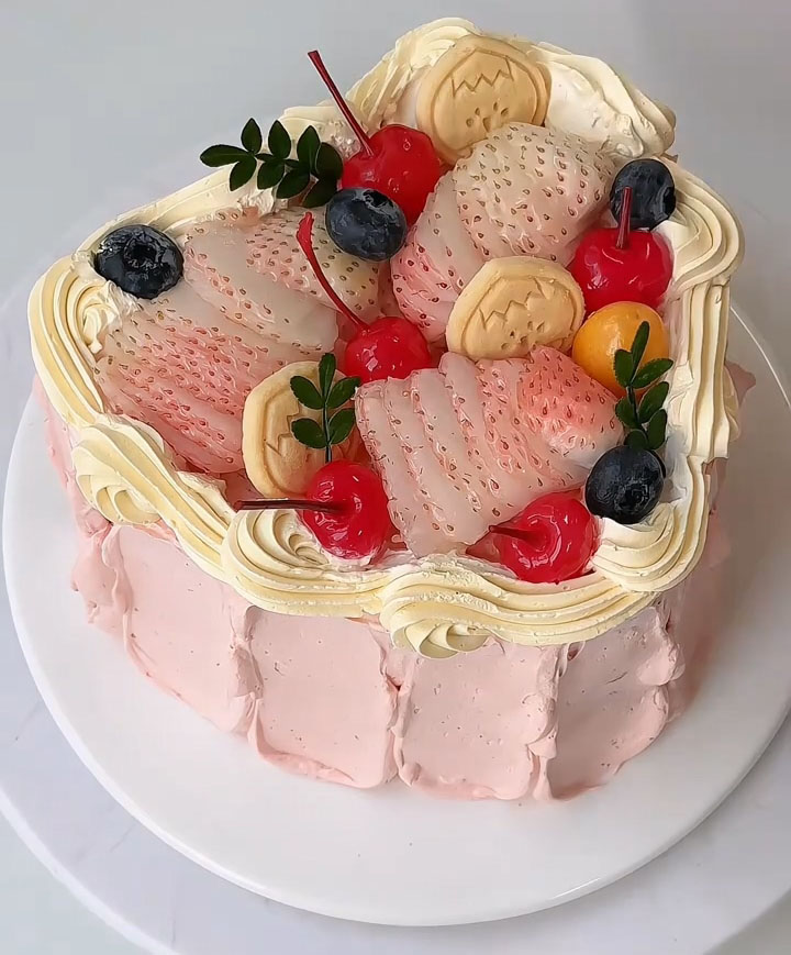 arrange fresh strawberries, blueberries, and cherries