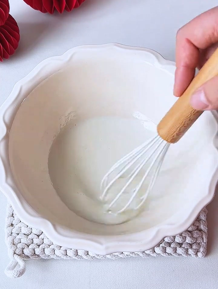 whisk together the corn oil and milk