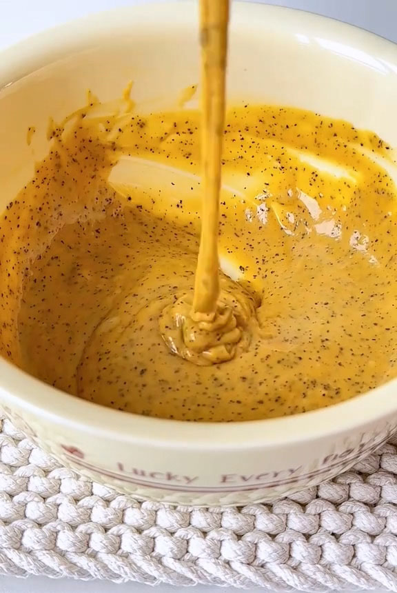 Add 3 egg yolks and continue folding until the batter is smooth, glossy, and completely free of lumps