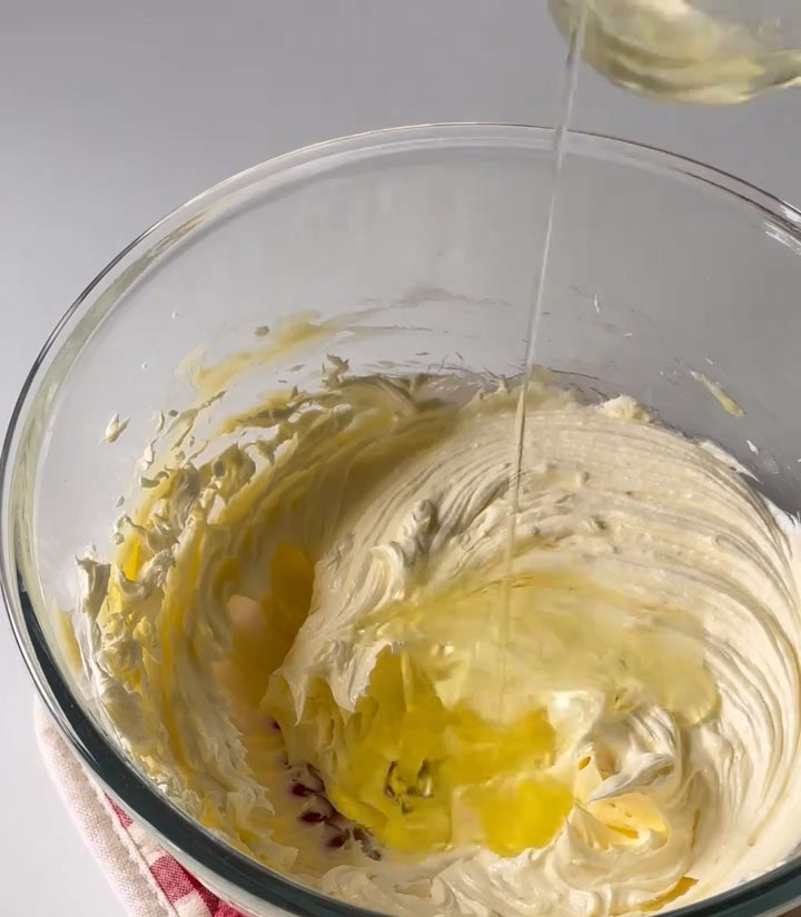 Add the egg white in two batches