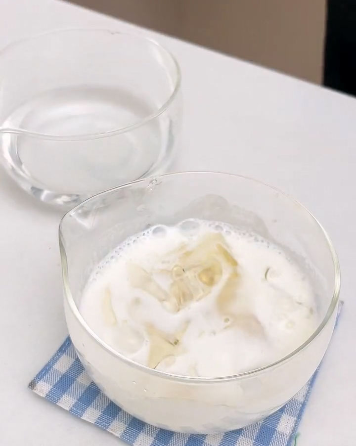 Add the softened gelatin to 50 g hot milk and stir until completely dissolved