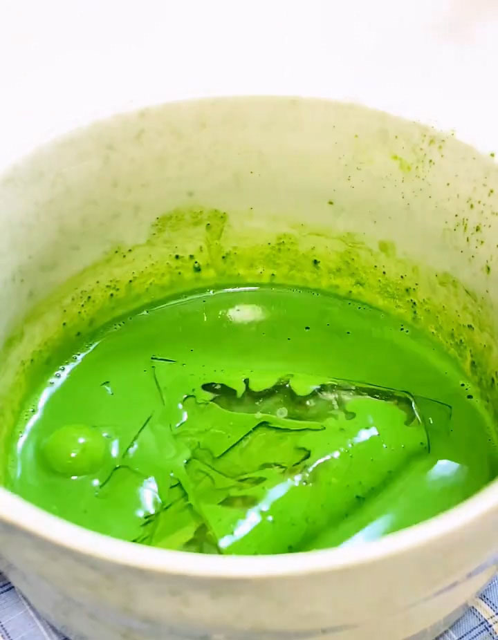 Add the softened gelatin to the hot matcha milk and stir until completely dissolved